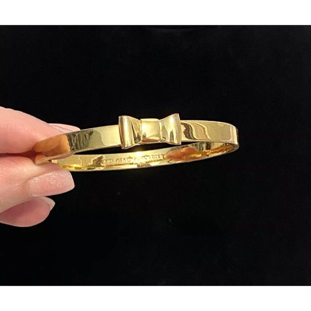 Kate Spade Goldtone bow bangle (PF) - Picture 1 of 7